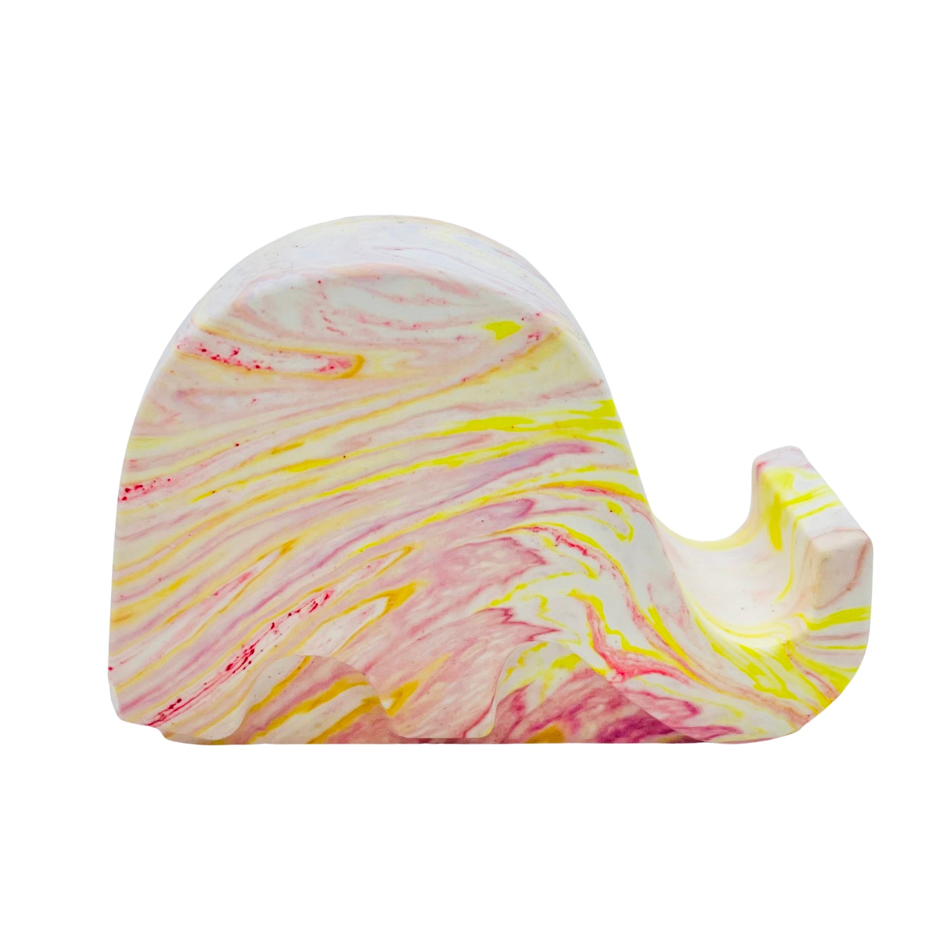 A Jesmonite elephant mobile phone stand measuring 6.5cm in length marbled with coral and yellow pigment.