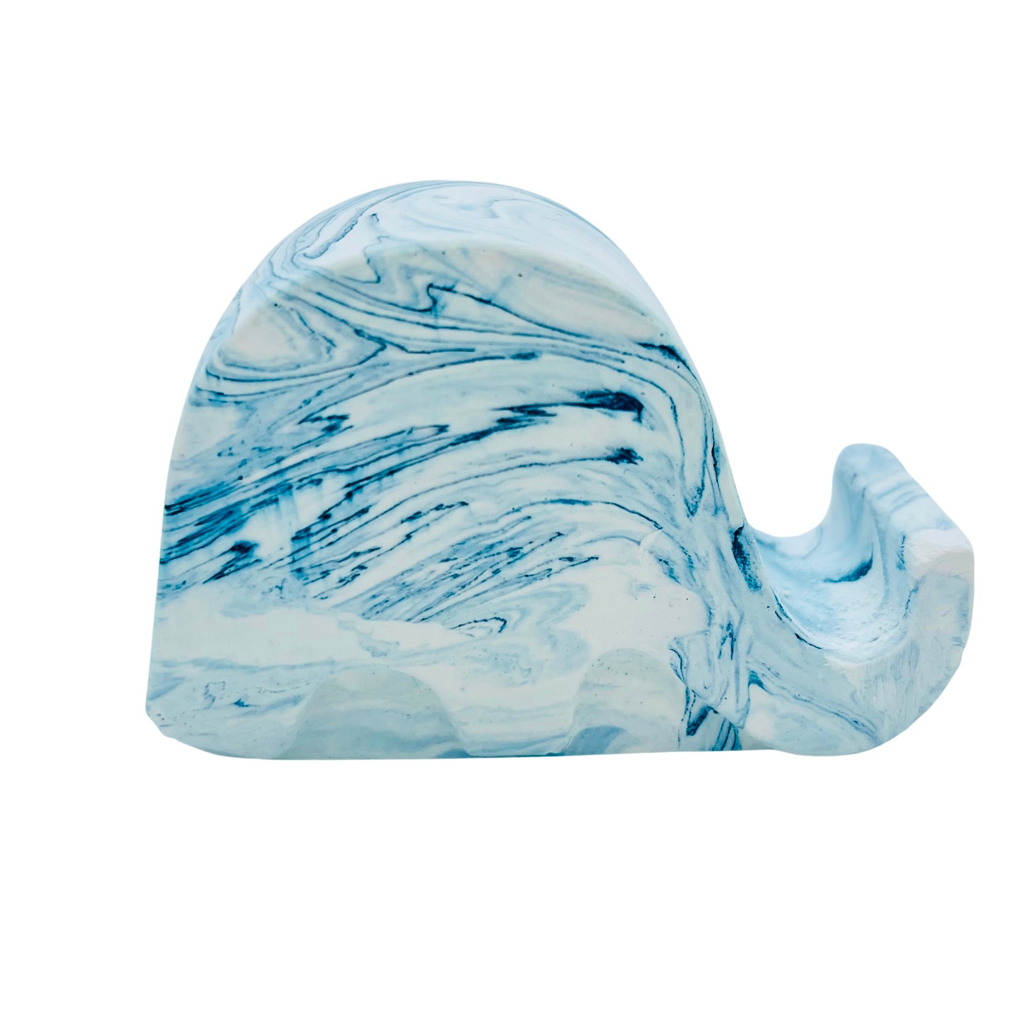 A Jesmonite elephant mobile phone stand measuring 6.5cm in length marbled with blue lagoon pigment.