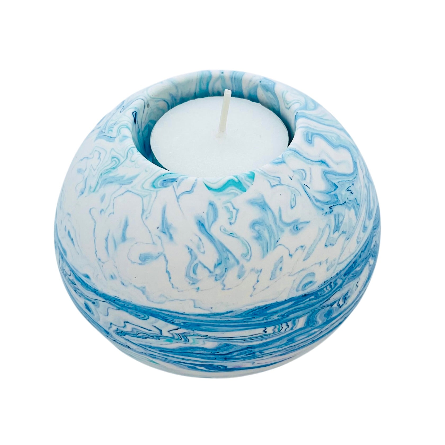A solid Jesmonite spherical tealight holder measuring 9.2cm in diameter marbled with baby blue and turquoise pigment.