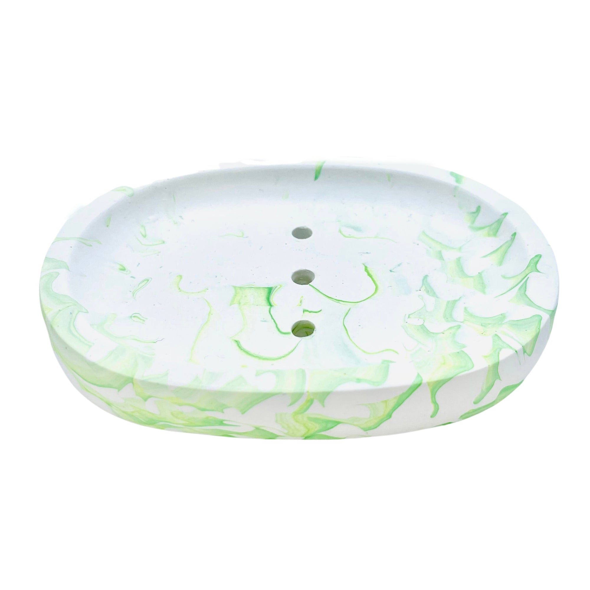 This oval Jesmonite soapdish measures 13.3cm in length and is marbled with lime green pigment.