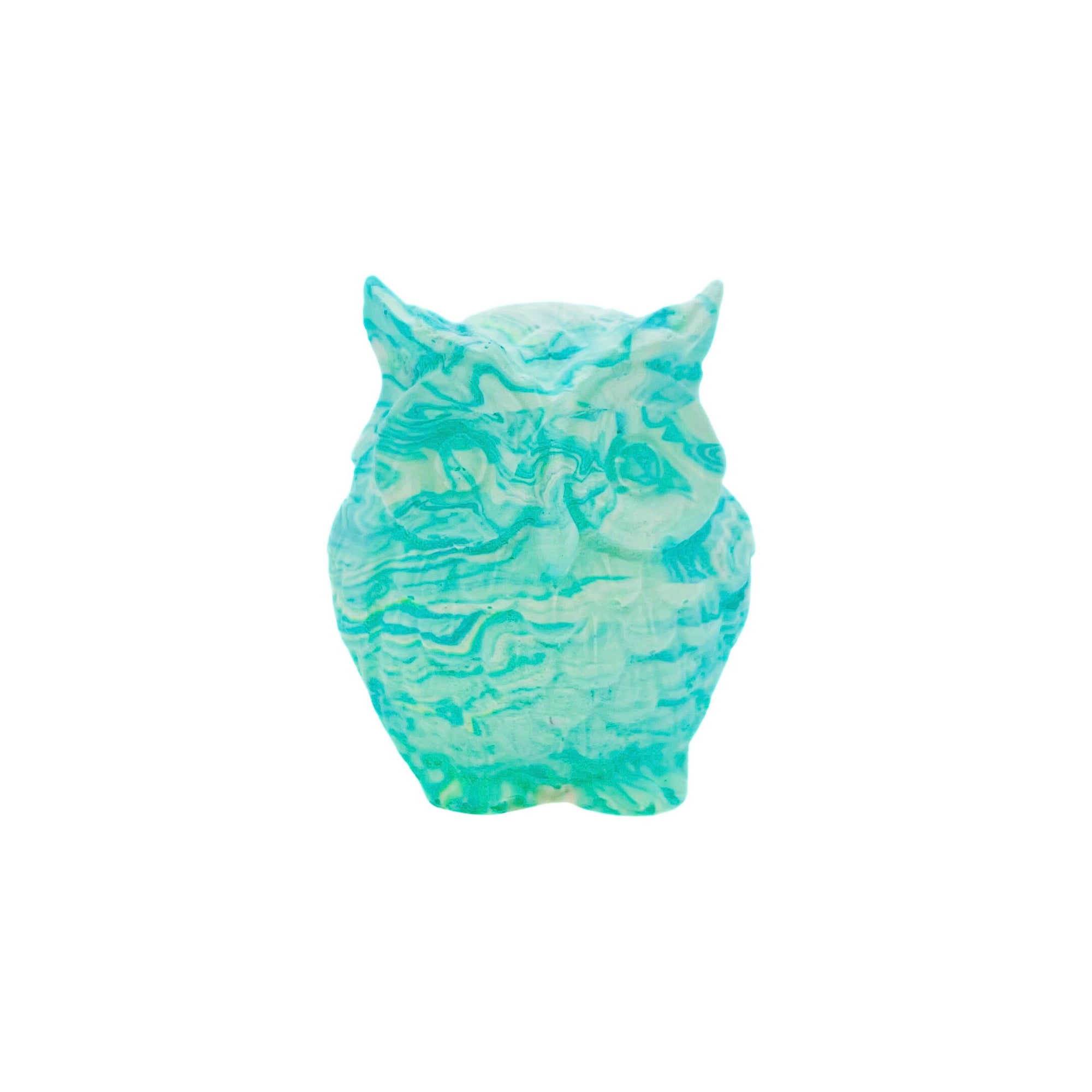A small owl made from Jesmonite measuring 5cm in height marbled with turquoise pigment.