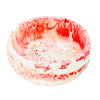 This eco-friendly Jesmonite bowl measures 15cm in diameter and is marbled with red and white pigment.