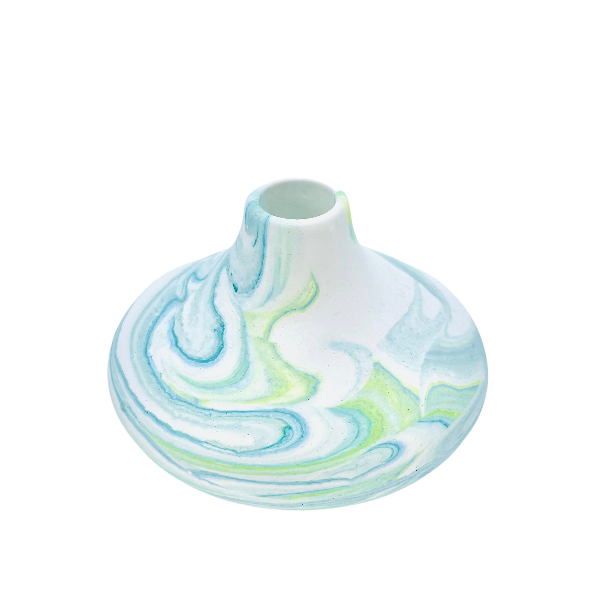 This small bulbous Jesmonite vase is marbled with turquoise and green pigment.