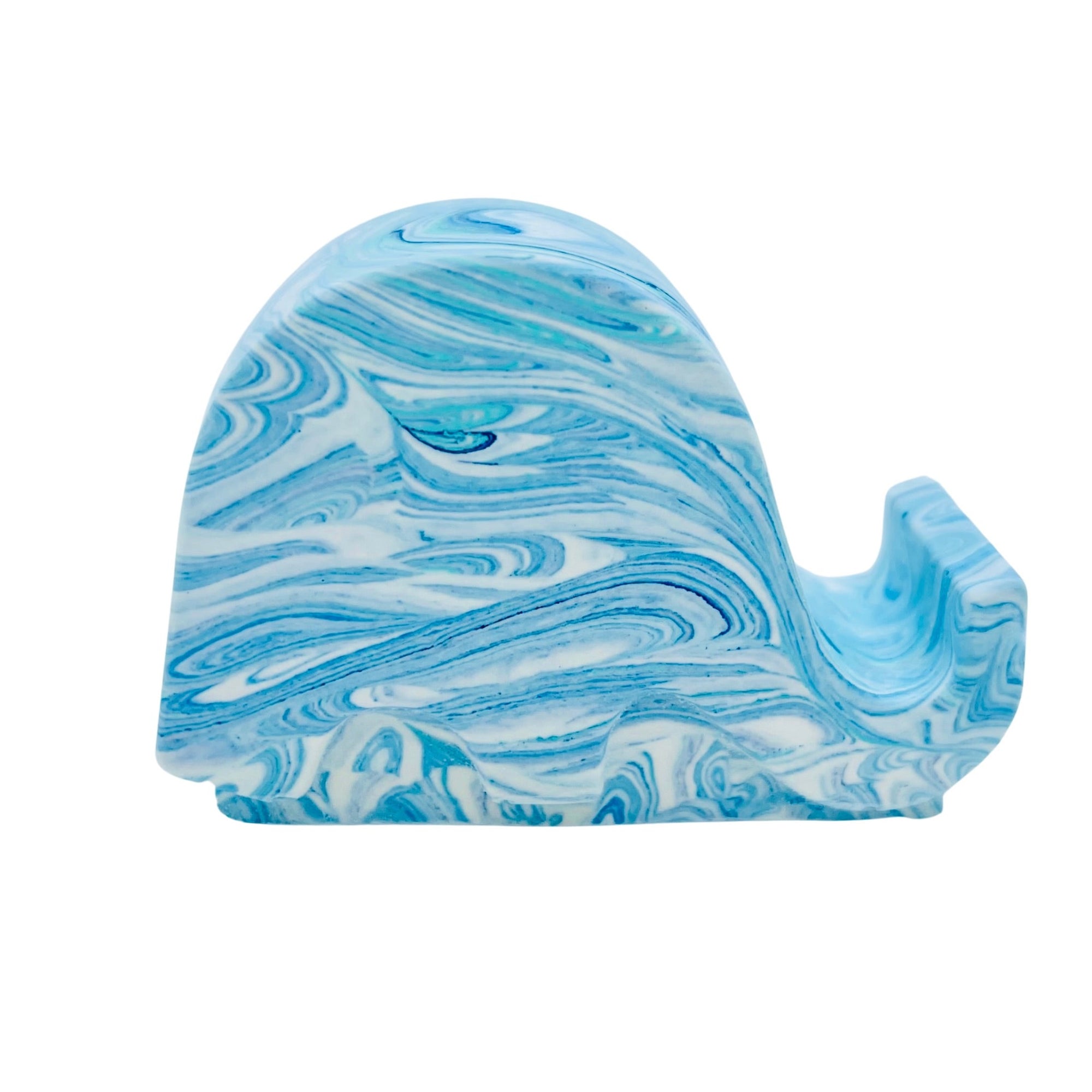 A Jesmonite elephant mobile phone stand measuring 6.5cm in length marbled with baby blue and turquoise pigment.