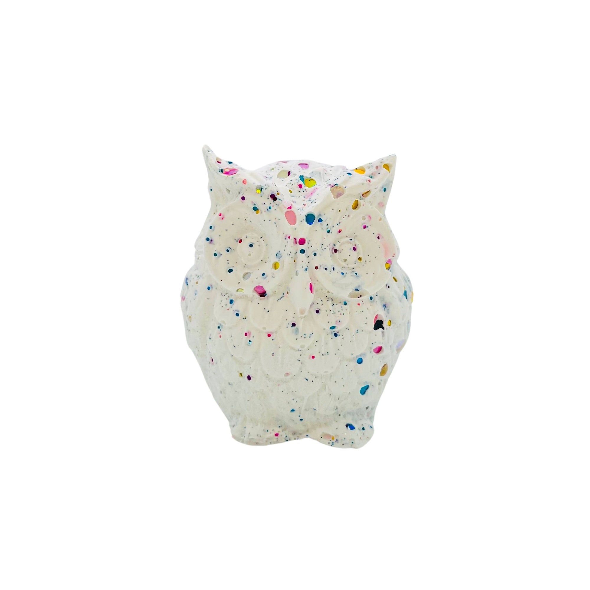 A small white owl made from Jesmonite measuring 5cm in height sprinkled with rainbow glitter.