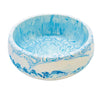 This eco-friendly Jesmonite bowl measures 15cm in diameter and is marbled with baby blue and turquoise pigment.