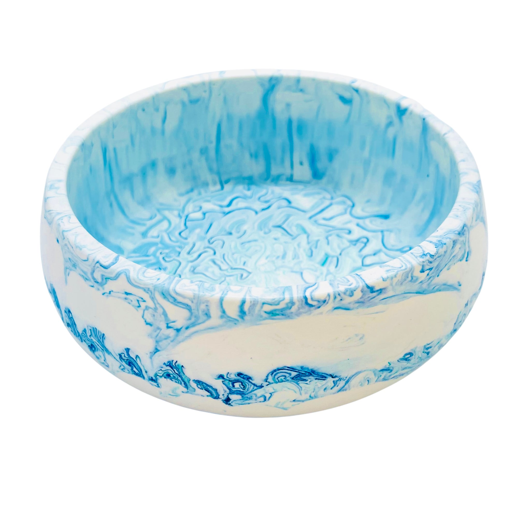 This eco-friendly Jesmonite bowl measures 15cm in diameter and is marbled with baby blue and turquoise pigment.