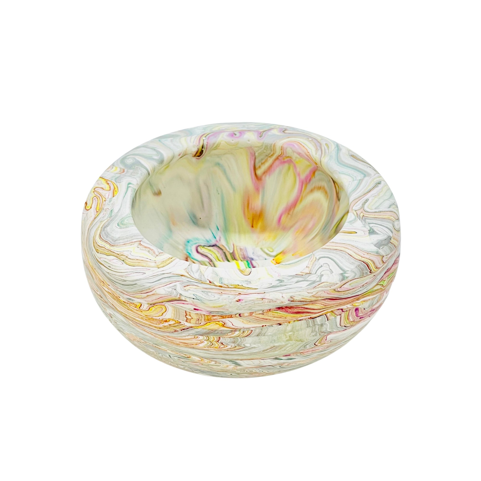 This small round jesmonite bowl measuring 10cm in diameter is marbled with multicolour pastel pigment.