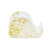 A white Jesmonite elephant mobile phone stand measuring 6.5cm in length sprinkled with gold glitter.