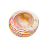 This small round jesmonite bowl measuring 10cm in diameter is marbled with coral and yellow pigment.