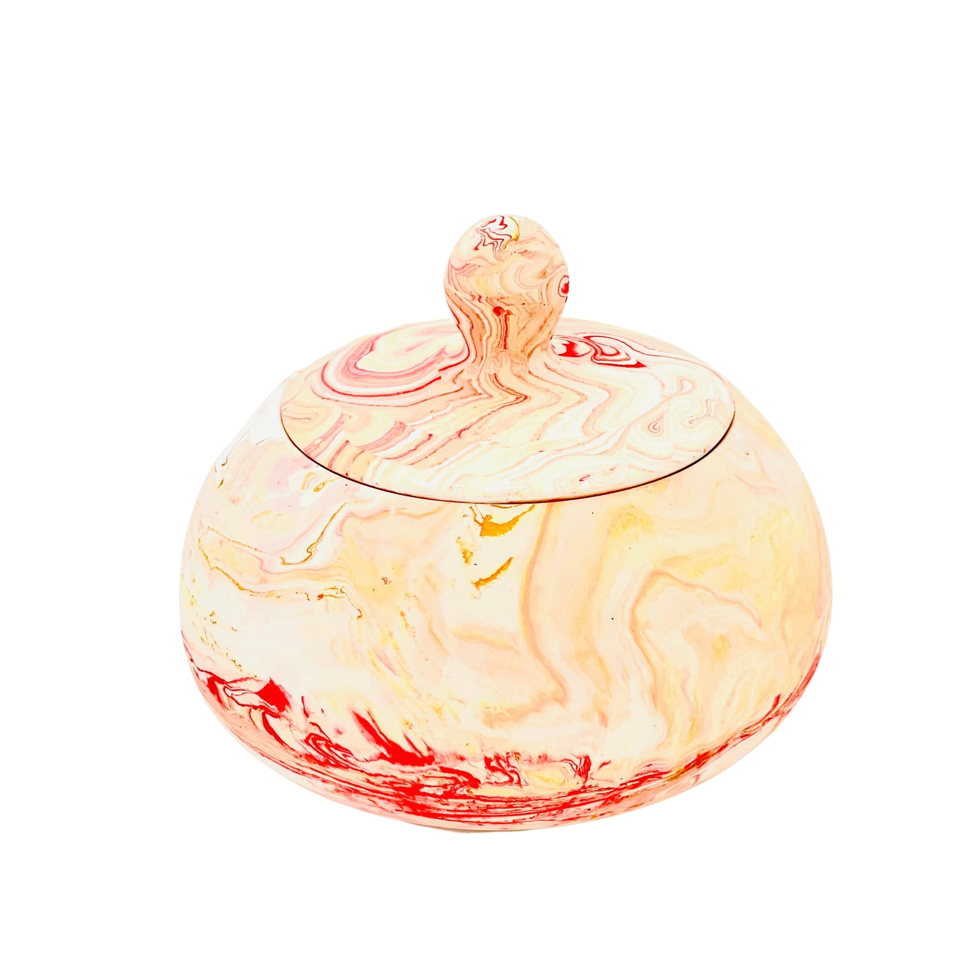 A Jesmonite globe shaped trinket bowl with lid marbled with red and orange pigment.