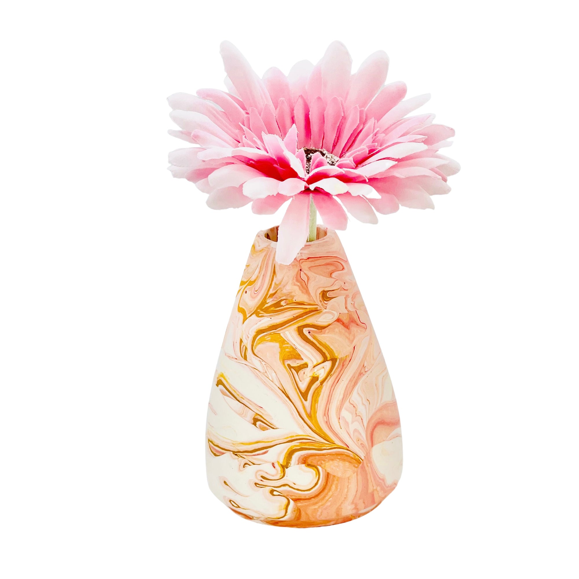 A Jesmonite conical vase that measures 7cm in diameter and 10cm in height marbled with peach pigment.