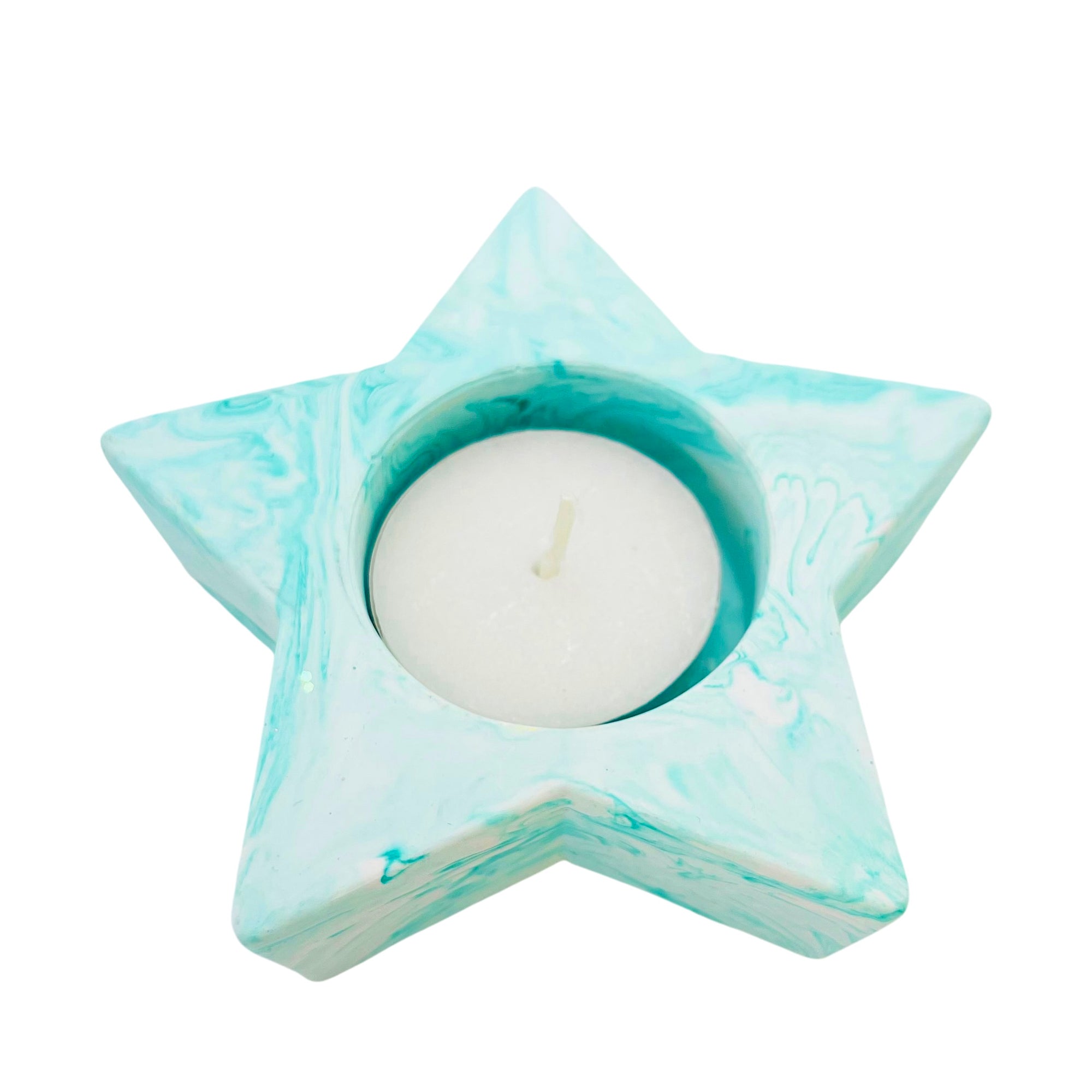 A star shaped Jesmonite tealight holder measuring 10cm in width marbled with turquoise pigment.