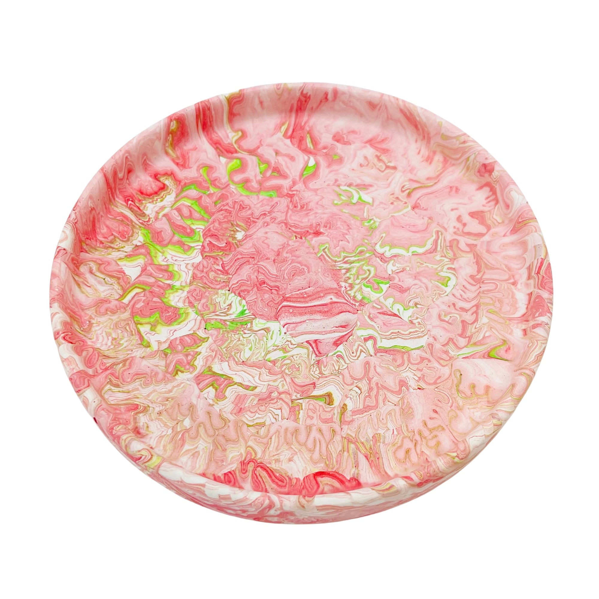A circular Jesmonite trinket tray measuring 15.4cm in diameter marbled with coral and lime green pigment.