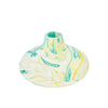 This small bulbous Jesmonite vase is marbled with turquoise and yellow pigment.