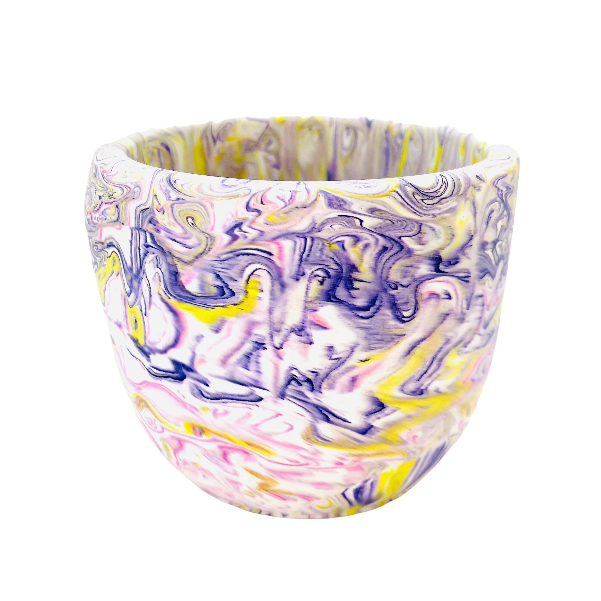 A  soft edged Jesmonite flower pot measuring 12.8cm in diameter,  marbled with swirls of purple, magenta and yellow pigment.