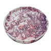 A circular Jesmonite trinket tray measuring 15.4cm in diameter marbled with aubergine pigment.