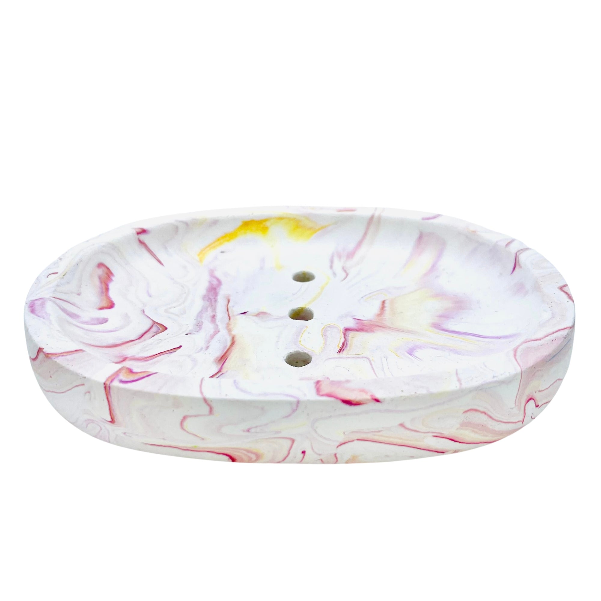 This oval Jesmonite soapdish measures 13.3cm in length and is marbled with magenta pigment.