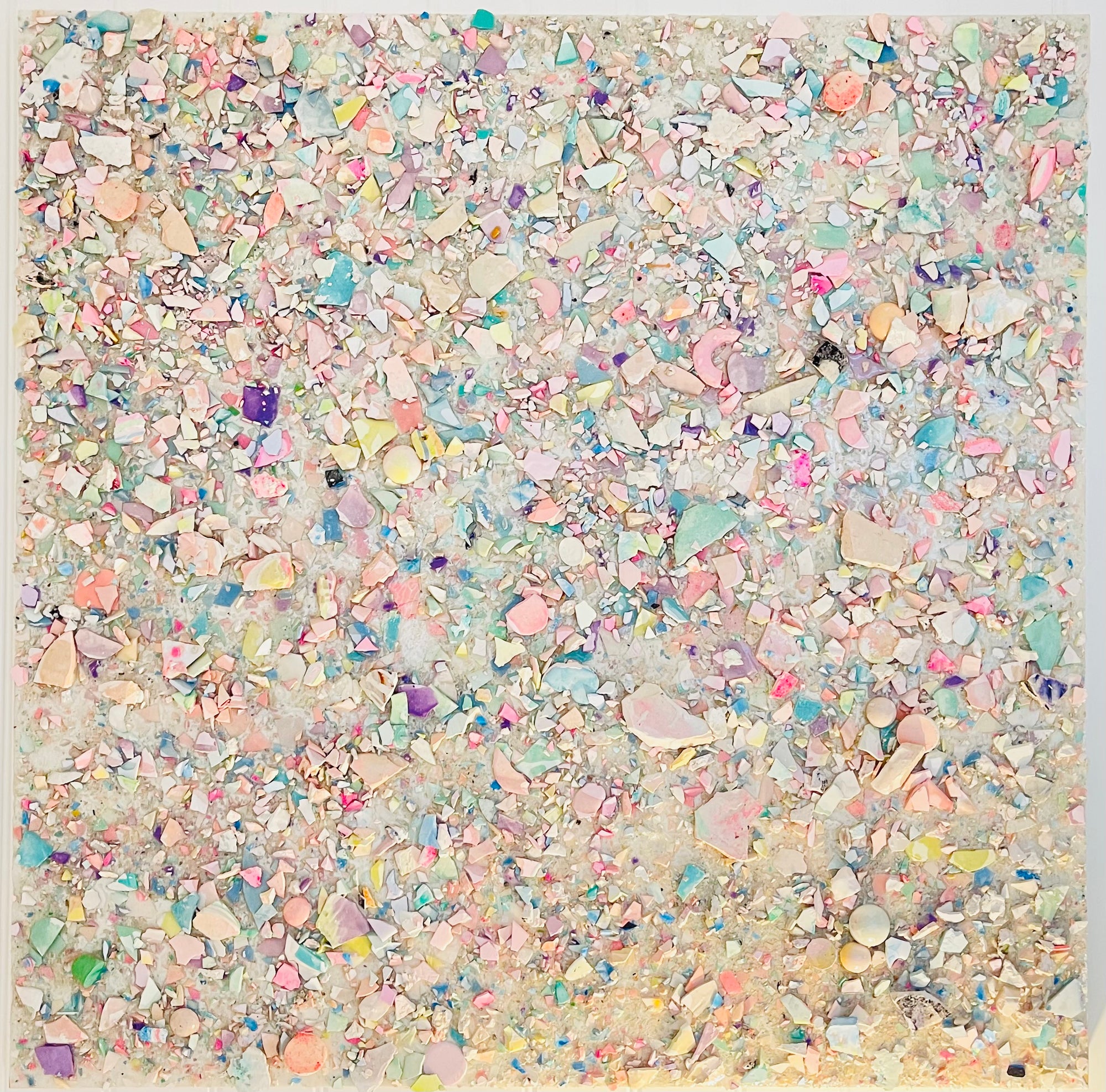 A textural abstract painting made from shards of pastel plaster and jesmonite finished with epoxy resin measuring 100cm x 100cm.